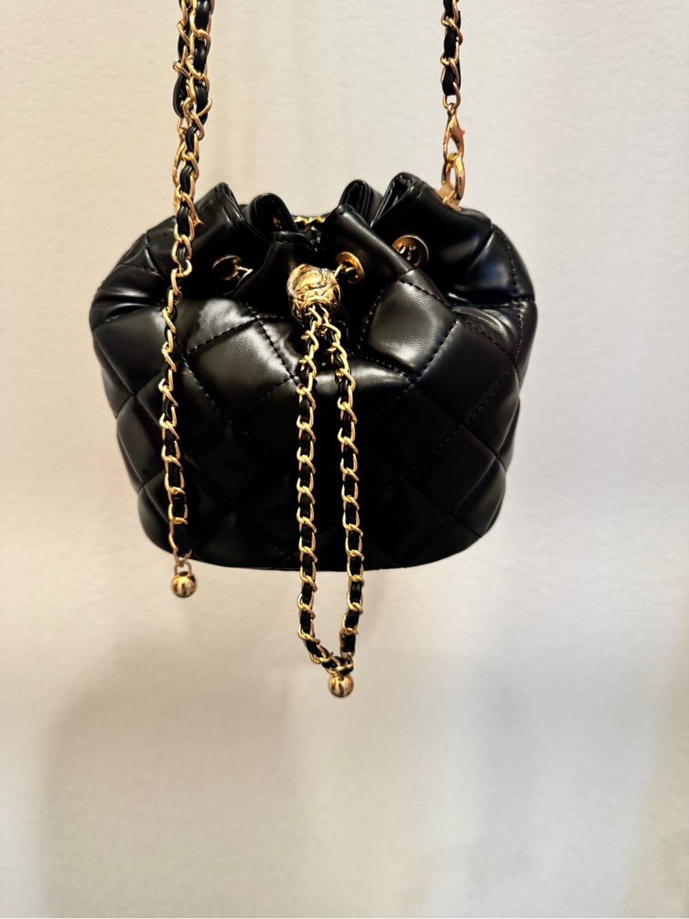 Black Quilted Drawstring Shoulder Bag with Gold Chain